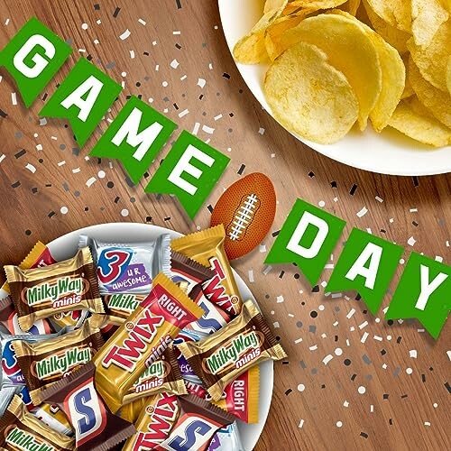 Bowl of chips and candy bars with game day sign.