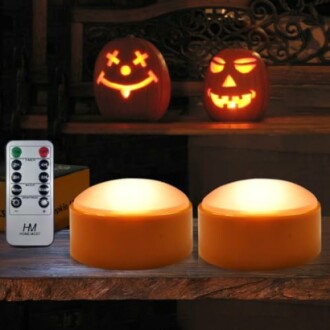 Two carved Halloween pumpkins and LED lights with remote control.