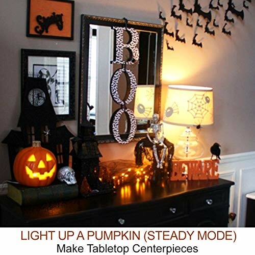 Halloween-themed table with pumpkin and spooky decor