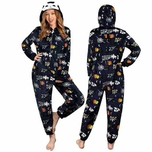 Two people wearing Halloween-themed onesies with skeleton and pumpkin patterns, laughing and having a great time together.