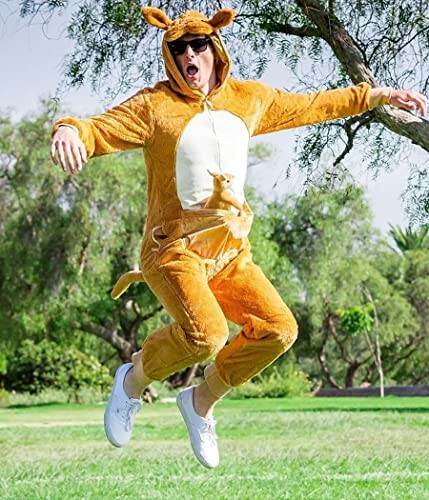 Person jumping in a kangaroo costume outdoors.