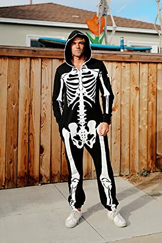 Person wearing a skeleton onesie standing outdoors