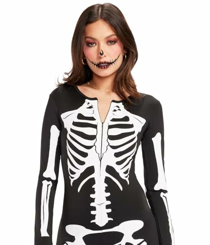 Woman in skeleton costume with skull makeup